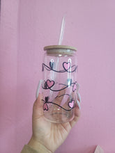 Load image into Gallery viewer, cute pink heart glass tumbler with bamboo lid and straw, aesthetic drink cup held in hand with pink background